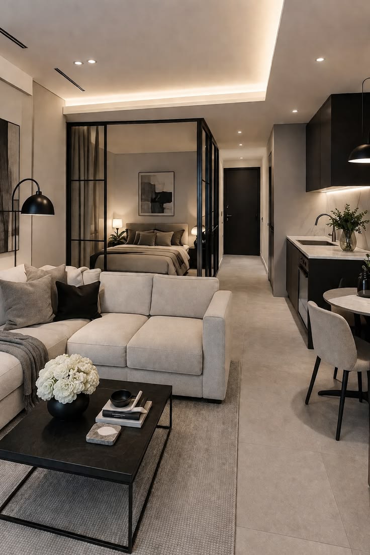 Modern neutral studio apartment with warm lighting and small-space decor